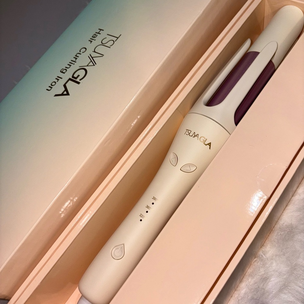 TUSAGLA Automatic Hair Curling Iron in Cream and Purple.